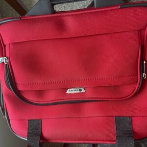 Delsey Red Travel/laptop Bag Durable Luggage with wheels 16”X17”x9”